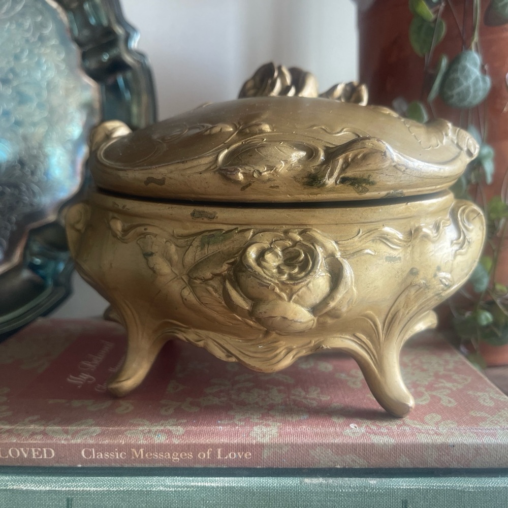 Vintage elaborate gold tone Nouveau rose design trinket box.